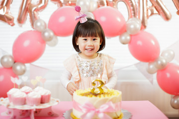 toddler girl celebrating her third birthday at home