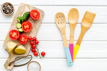 Fresh organic vegetables for healthy food cooking on white wooden background top view