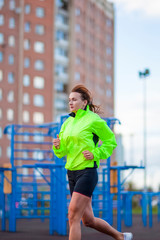 Fitness and Healthy Lifestyle Concepts. Female Athlete Having Running Exercise Outdoors.