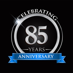 Celebrating 85 years anniversary logo. with silver ring and blue ribbon.