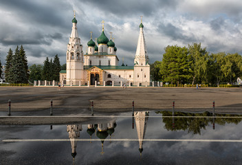 Wall Mural - Temple of Elijah the Prophet in Yaroslavl on a summer day after rain with reflection in a puddle, Russia