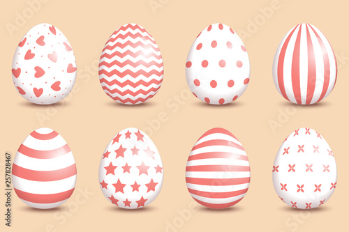 Set of realistic easter decorated eggs on coral background. © mrFox11