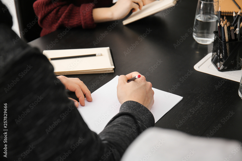 Man sitting at table during business meeting