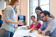 © NDABCREATIVITY - Company coworkers discussing ideas and brainstorming