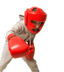 Wall Mural - Young sportsman boxer with gloves and head protection. Ready to attack. Isolated on white background.