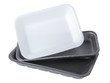 Set of two black and one white empty food tray. Collection disposable styrofoam isolated on white background