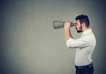 Side profile of businessman with binoculars