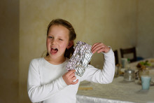 Girl Found It. Afikoman Is A Half-piece Of Matzo Which Is Broken Of The Passover Seder.In Many Families The Father Takes The Afikoman And Hides It.The Child That Finds The Afikoman Receives Gift.