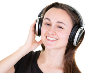 Wall Mural - young woman laughing and listening to music with phone earphones