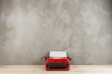 Wall Mural - vintage typewriter on the table with blank paper - concept for writing, journalism, blogging