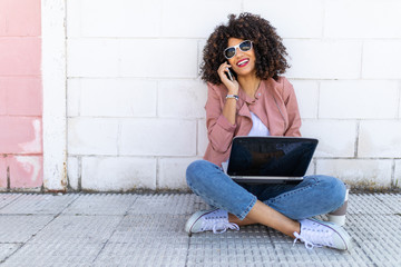 Young brunette girl of curly smiling and happy