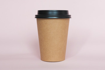 Wall Mural - Coffee cup on pink paper background. A couple of paper cups of coffee to take away.