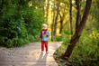 © Maria Sbytova - Little boy playing during stroll in the forest