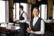 © Pixel-Shot - Young waiters in restaurant