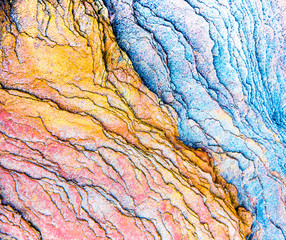 colourful sedimentary rocks formed by the accumulation of sediments – natural rock layers background