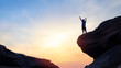 © elbanco - silhouette man rising hands on top of mountain , success concept