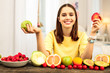 © Viacheslav Yakobchuk - Smiling young woman eating various healthy food