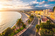 © AWL Images - High angle view of promenade by beach during sunset