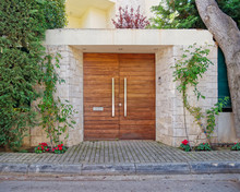 Elegant Contemporary House Entrance Wooden Door And Red Flowers, Athens Greece