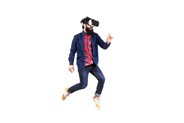 full length portrait of young bearded hipster man in virtual reality glasses, jumping and touching invisible buttons, isolated on white background