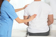 © New Africa - Doctor working with patient in hospital, closeup. Rehabilitation massage