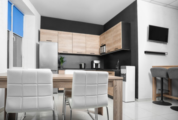 Cozy modern kitchen interior with new furniture and appliances