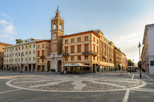 Central Square Of Rimini, Italy. Three Martyrs Square With An Ancient Clock Tower.