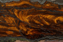 Macro Stone Tiger Eye Mineral In Rock On Black Background