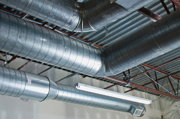 Looking up in the warehouse at the new bent vents in the rafter area. 