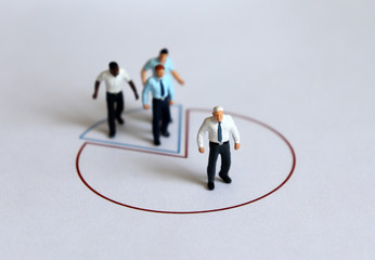 Wall Mural - Miniature people standing on a circle graph.