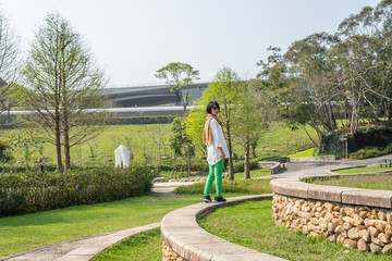 Poster - traveling Asian woman walking