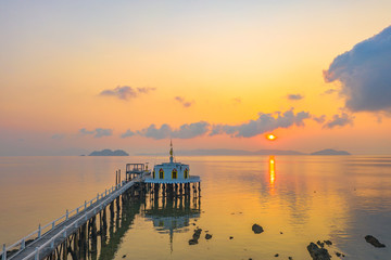  aerial view sunrise at pier of Phayam temple one landmark of Phayam island. Phayam temple is on Hin Kao gulf. .The temple is close to the shipping port. in the end of Phayam temple pier have memorial