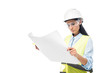 © LIGHTFIELD STUDIOS - Concentrated engineer in safety vest looking at blueprint isolated on white