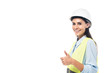© LIGHTFIELD STUDIOS - Smiling engineer in hardhat and safety vest showing thumb up isolated on white