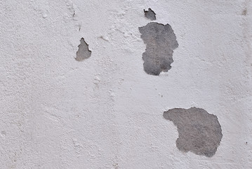 peeling white paint on concrete wall, texture