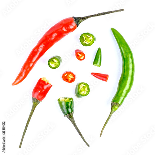 red and green hot chilli peppers on white background © qwasder1987