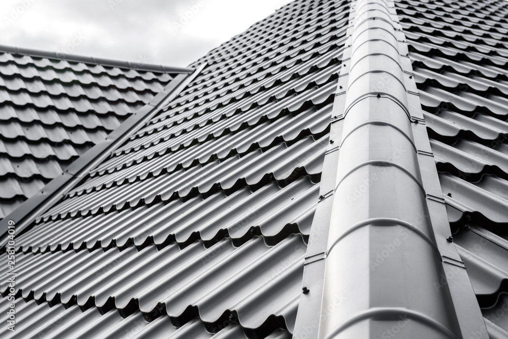 Construction of the roof of the house. Metal tiles. - obrazy, fototapety, plakaty 