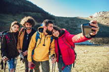 Group Of Hikers On A Mountain At Autumn Day Make Selfie Photo