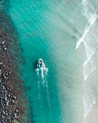 Speed boat cruising in the blue ocean and sand banks on the Gold Coast, Australia