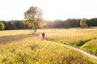 © Sarah Rypma - Mother and daughter walking in field