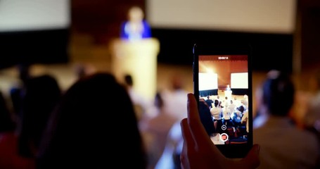 businesswoman recording lecture during business seminar in auditorium 4k