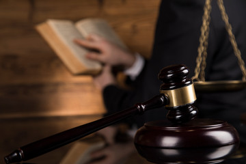 Judge, male judge in a courtroom striking the gavel