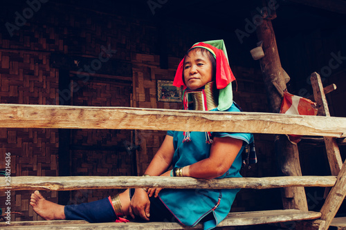 Plakat Long Neck Woman wearing at traditional costume. Tribal village Thailand.
