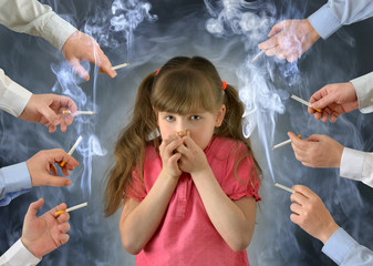 Smoking in front of the child kid .A little girl covers her nose from tobacco smoke.Conceptual photography.