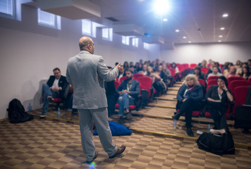 Wall Mural - successful businessman giving presentations at conference room