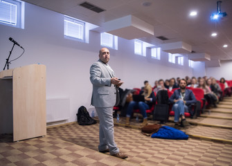 Wall Mural - successful businessman giving presentations at conference room