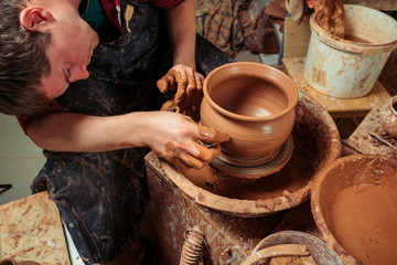 Potter at work. Workshop place.