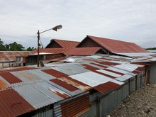 Roof Of An Old House Slums In Asia, The Abandoned Buildings Were Damaged And Corroded