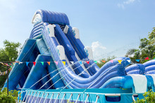 Inflatable Slide Bounce Or Water Sliders At Water Park