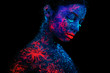 Profile portrait of a beautiful girl alien. Ultraviolet body art blue night sky with stars and pink jellyfish